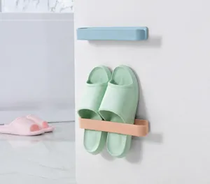 Detail view of wall-mounted shoe rack organizer installed in a modern bathroom setting
