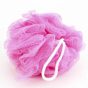 Soft pink nylon mesh bath sponge with white hanging loop for gentle skin exfoliation.