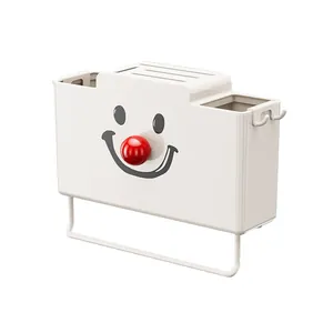 Organizer da cucina a parete per utensili e asciugamani con simpatica faccia sorridente.