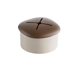 Minimalist mushroom shaped towel holder with brown silicone cross plug for bathroom.