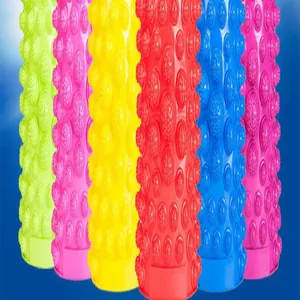 Macro detail of multi-colored textured foot massage rollers with acupressure nodes