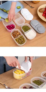 Detail of dual-compartment sealed food container showing easy-open buckle lid design