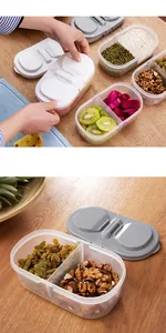Detailed view of dual-compartment airtight food storage containers with snap-lock lids.