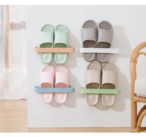 Modern wall-mounted multi-color storage racks holding slippers on a clean white wall