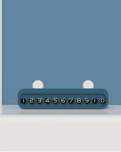 Close-up view of a minimalist blue car temporary parking phone number card ornament