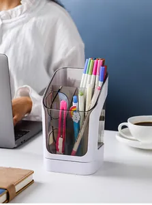 Detailed view of white multi-compartment desk organizer with stationery