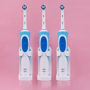 Universal wall-mounted electric toothbrush holder stand with white adhesive base for bathroom