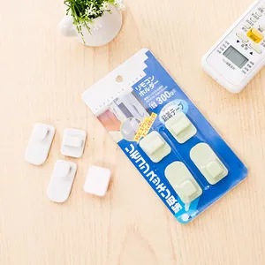 Self-adhesive wall-mounted remote control holder hooks with 300g load capacity for home
