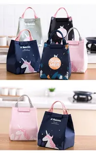 Detailed view of insulated lunch bags with unicorn and summer prints in various colors