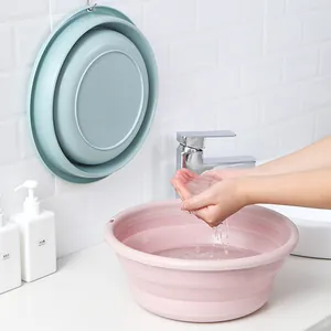 Versatile folding plastic washbasin for household bathroom use in pink and blue