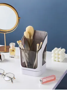 Macro detail of white slanted makeup brush holder on desk with minimalist decor