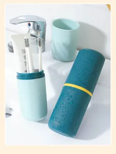 Detail showing a portable travel toothbrush storage cup set in a bathroom setting