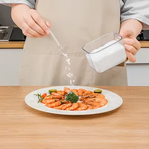 Transparante keukenkruidendoos met lepel voor het bewaren van zout en suiker weergave