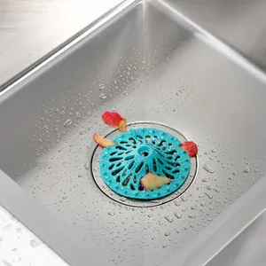 Turquoise volcano-shaped silicone sink strainer and hair catcher for kitchen drains.