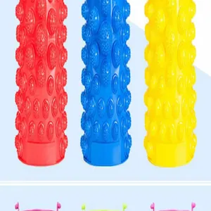 Macro detail of textured acupressure foot massage pads in red, blue, and yellow