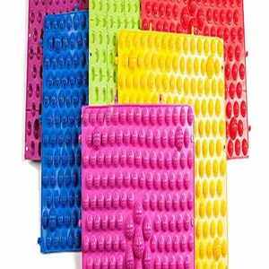 Colorful acupressure foot massage mats with textured bumps for reflexology therapy