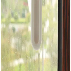 Detail of white self-adhesive window pull handle showing the smooth rounded bottom edge