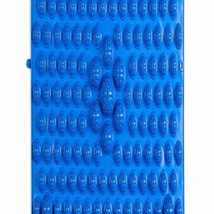 Macro view showing the detailed texture and patterns of a blue acupressure foot massage mat