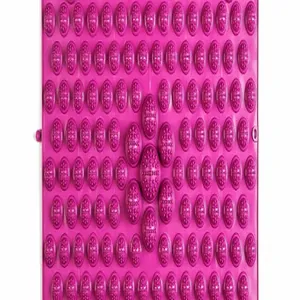 Macro view of textured pink foot massage mat with multiple acupressure pressure points