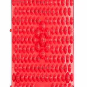 Close-up macro detail of a red acupressure foot massage mat featuring bamboo shoot nodes
