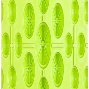Detailed macro shot of a bright lime green acupressure mat featuring circular texture