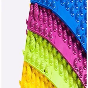 Close-up macro view of colorful acupressure mats showing detailed textured massage bumps