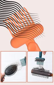 Close-up detail of a dual-head comb cleaning claw removing hair from hairbrushes.