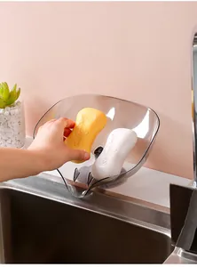 Escurridor con ventosa de plástico gris con detalle de almacenamiento de jabón en el fregadero