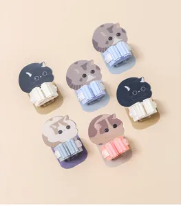 Six styles of cartoon cat wall-mounted mop and broom holders in various colors