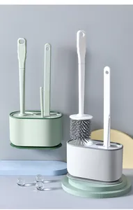 Detailed view of wall-mounted and standing toilet brush sets in pastel colors.