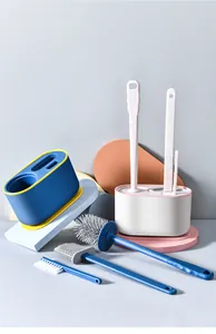 Detailed view of cleaning brush set with silicone and nylon heads on geometric props
