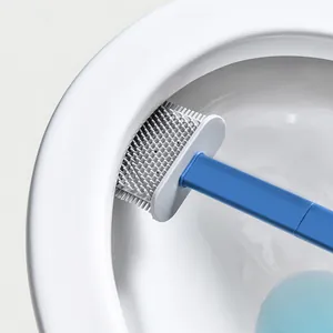 Flexible silicone toilet brush cleaning the inner rim of a clean white ceramic toilet bowl