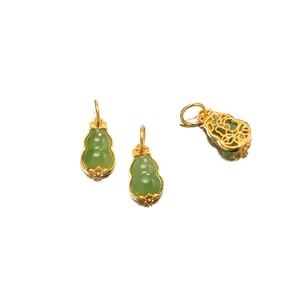 Close-up detail of S925 silver gold-plated Hetian jade gourd pendants with hollow back