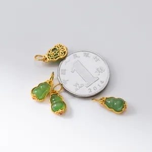 Close-up of S925 silver plated Hetian jade gourd pendants with coin for size reference