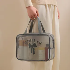 Grey mesh toiletry bag with handle, breathable cosmetic storage pouch for travel and swimming.