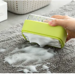 Close-up detail showing rich foam production on grey mat using green soap box with rollers