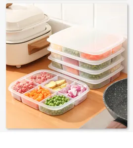 Divided food storage containers for meal prep with colorful diced vegetables and meat