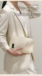 Close-up detail of a minimalist cream PU waterproof electronic and cosmetic organizer pouch