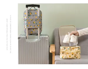Portable lemon print shoe storage bag showing suitcase attachment and interior capacity