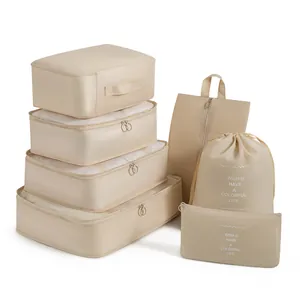 Set da 7 pezzi di organizer da viaggio beige e cubi per l'organizzazione della valigia