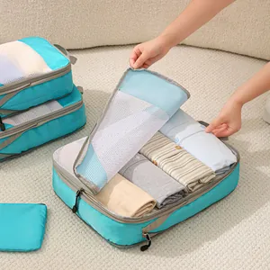 Set di cubi da imballaggio da viaggio ciano con rete per organizzare i vestiti