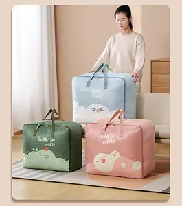 Three large cartoon Oxford cloth quilt storage bags in green, blue, and pink colors