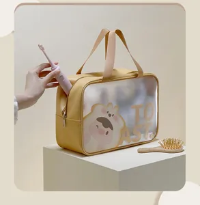 Large yellow PU toiletry bag with toast cartoon and dual handles on a white pedestal