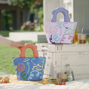 Tragbare wasserdichte Lunchtasche mit süßem Smiley-Muster für Picknicks im Freien