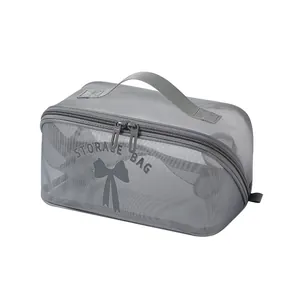 Grand sac de toilette en maille grise avec poignée et motif nœud