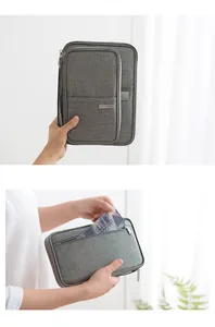 Detail of grey waterproof passport holder with cationic fabric and multi-functional pockets.