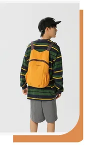 Back view of a yellow foldable ultra-light water-repellent outdoor travel backpack