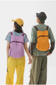 Lightweight and foldable outdoor backpack for hiking and travel in vibrant purple and yellow