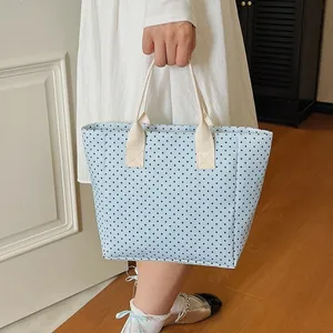 Stylish light blue polka dot tote bag with cream handles and large capacity design