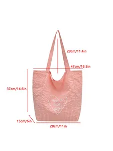 Detailed view of pink canvas tote bag showing dimensions in centimeters and inches.